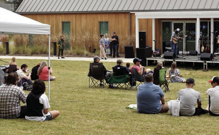 Colin Cutler and Hot Pepper Jam, of GCSU’s Music Department, Sally Jaye, and special guest Rob Sumowski played throughout the day on the stage set up in front of Andalusia Farm’s Interpretive Center. Attendees brought tents, blankets, and chairs to enjoy the day’s festivities.