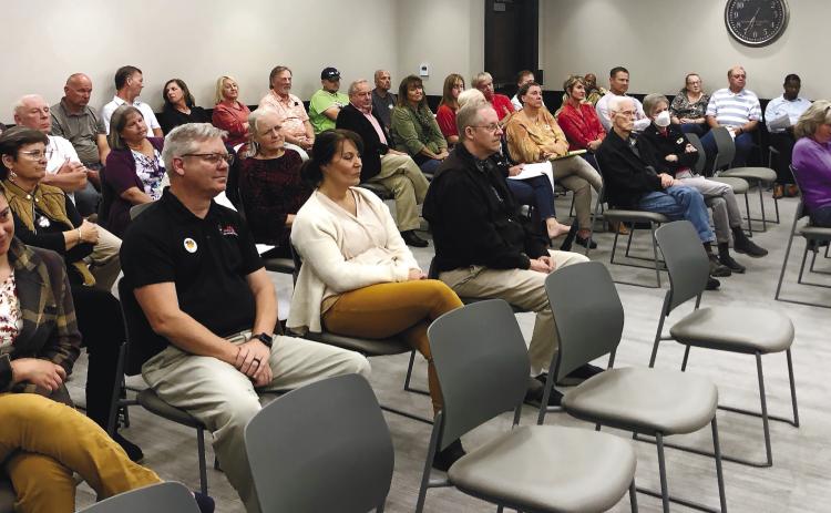 A crowd was on hand at Tuesday’s county commission meeting, during which the board voted 4-1 to remove construction of new hangars for the airport from the county’s Capital Improvements Plan. GREENBERRY MOORE/Staff