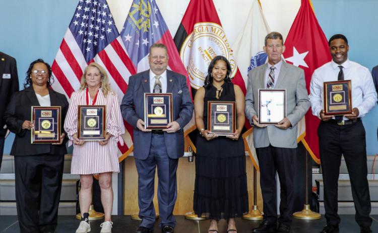 Award winners gathered on stage to accept each of their recognitions during the annual alumni weekend. COURTESY OF GMC