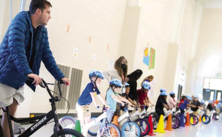 Students line up with an instructor to practice balancing. ERIC JONES/Contributed