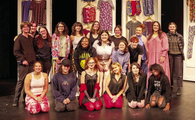 The cast of “MLM is for Murder” against a backdrop of the clothes sold by the multilevel marketing consultants featured throughout the play. BRIAN WALLENBERG/SATURNBLU PRODUCTIONS.