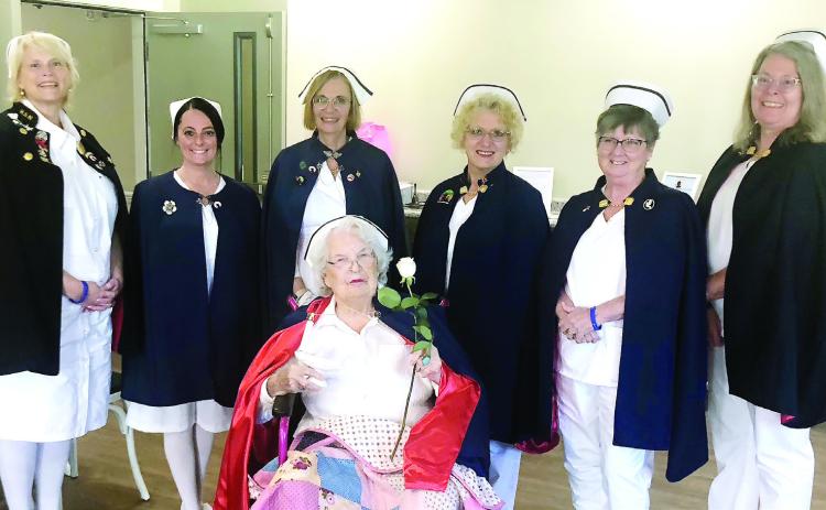 L-R: Warner Robins Nurses’ Honor Guard Amy Malcom, Morgan Fordham, Joyce Taylor-Norris, Akelajo Connell, Patsy pepper, and Cindy Jones honor Jacqueline Northington (center). GREENBERRY MOORE/Staff