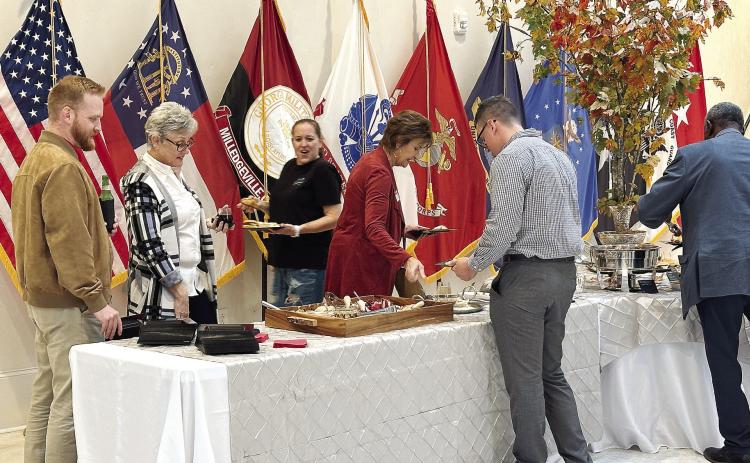 Millegeville-Baldwin Chamber of Commerce members enjoy the buffet inside the NewDay USA Center of Leadership at Georgia Military College. ALIVIA BLANTON/Staff
