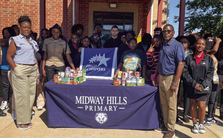The High Achievers Program donated about 75 canned goods Sept. 10 to the Midway Hills Primary Food Pantry. The group began collecting canned goods July 31 during its field trip to Middle Georgia State University and the Harriet Tubman Museum. CONTRIBUTED