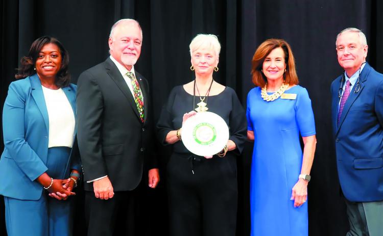 The Baldwin County School District School Nutrition Department accepts the award for its Farm to School program. CONTRBUTED