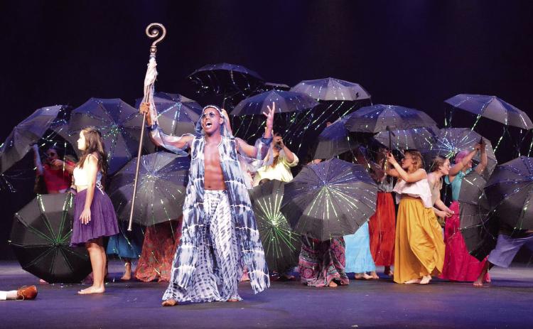 The sly Demon of Death Papa Ge (center) is the main antagonist of the musical and convinces Ti Moune (left) to give up her life for another. MANDY ELDER/Contributed