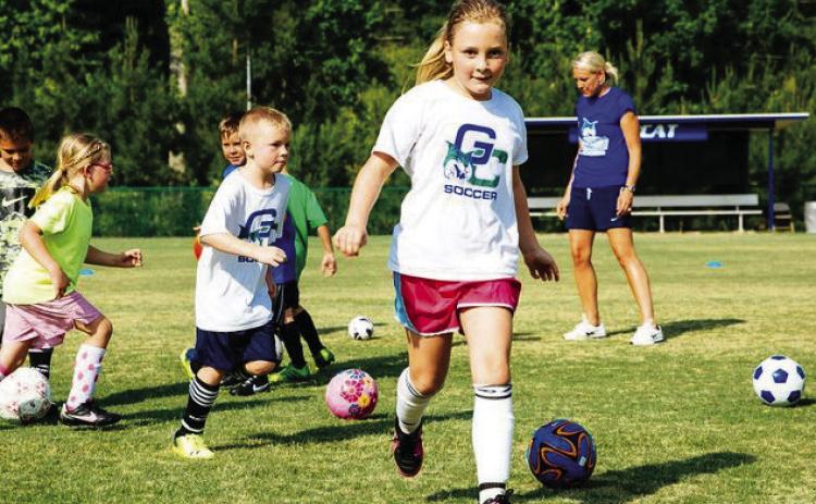 Campers play with balls and other items during free-time. CONTRIBUTED