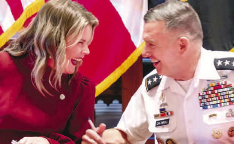 President of Wesleyan College Meaghan Blight and GMC President William B. Caldwell IV sign an articulation agreement to establish a ‘bridge’ between Georgia Military College and Wesleyan College. COURTESY OF GMC