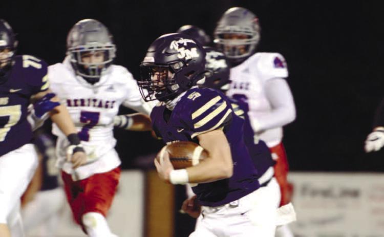 John Milledge Academy’s quarterback Briggs Eady (5) had a big game Friday night versus Valwood, leading his Trojans to the state final game in Macon this week. IAN TOCHER/Staff