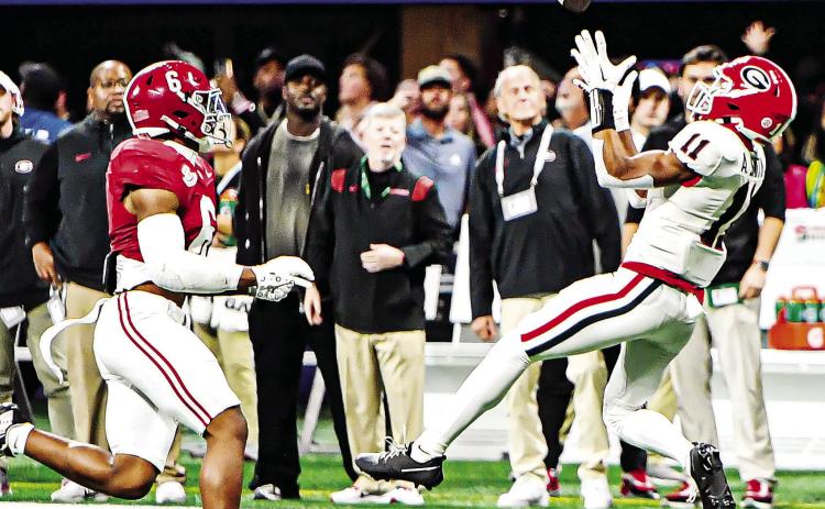 Georgia wide receiver Arian Smith (11) got into the action during the SEC Championship game against Alabama on a 51-yard reception. CHARLES JORDAN/Staff