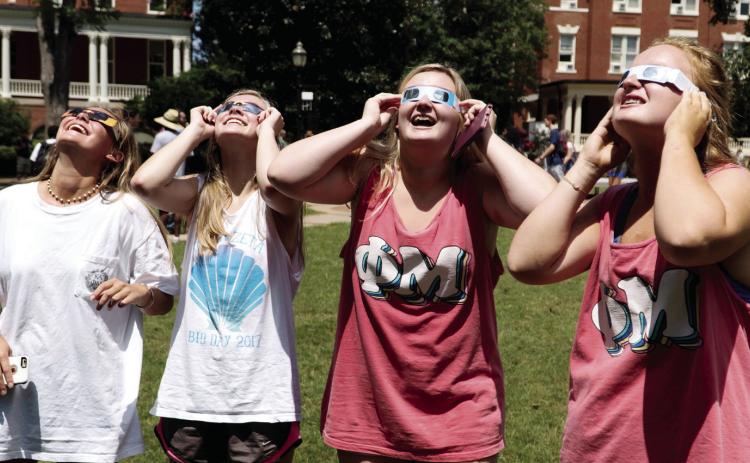 Students watch the 2017 solar eclipse on GCSU’s front lawn. COURTESY OF GCSU