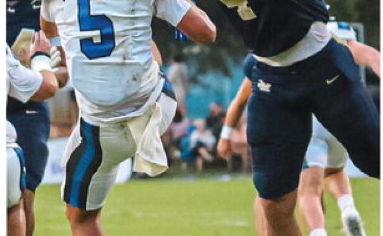 Trojans trounce Cougars to remain undefeated
