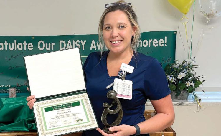 Atrium Health Navicent Baldwin Intensive Care Unit nurse Heather Hall recieves the DAISY Award. CONTRIBUTED