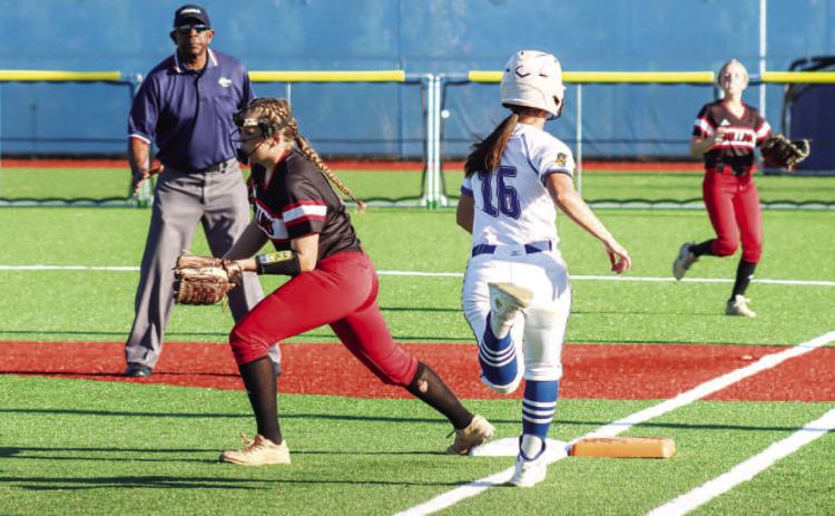 Lake Oconee Academy’s Mary Claire McCommons (16) tries to beat out a throw at first base. LANCE MCCURLEY/Staff