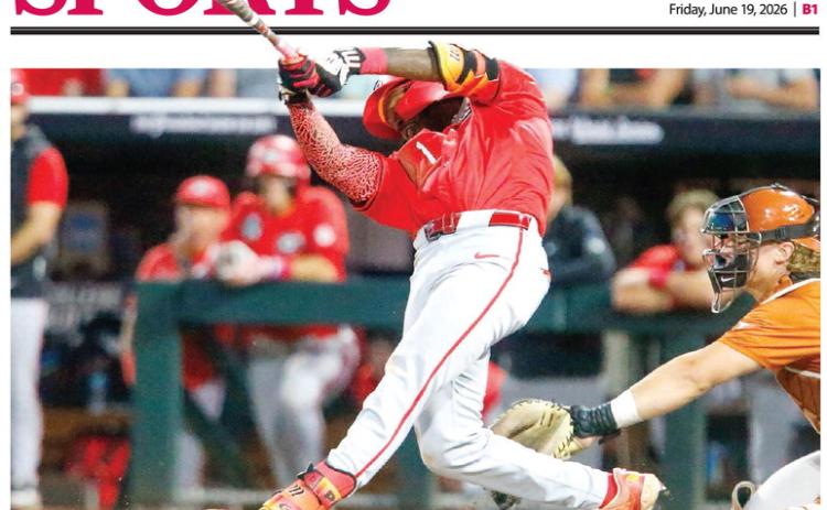Georgia third baseman Tre Phelps blasts a single in the seventh inning against Texas on Tuesday night. LANCE McCURLEY/Staff