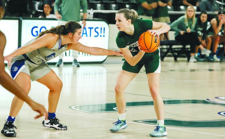 Harper Vick takes opposing forward one on one. COURTESY OF GCSU ATHLETICS
