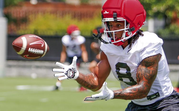 Georgia veteran defensive back Joenel Aguero prepares to catch a pass while participating in position drills during a practice on Thursday, July 31. LANCE McCURLEY/Staff