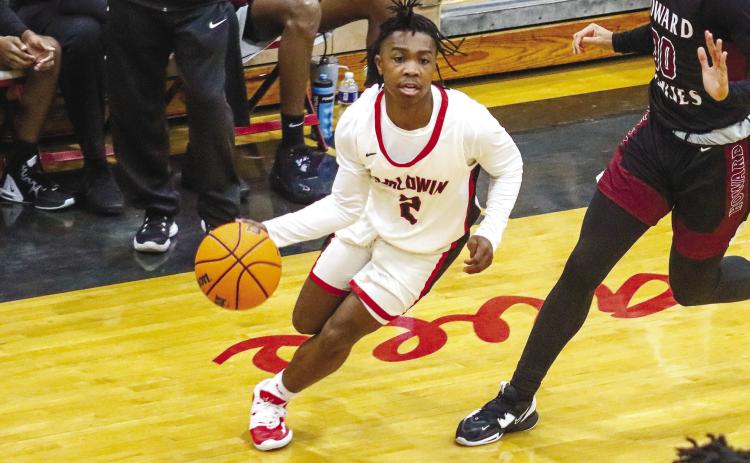Senior Jordan Webb (2) in transition looking for an opponent to pass the ball to inside the paint during a win over Howard in January. LANCE MCCURLEY/Staff