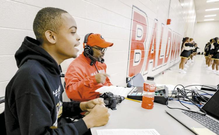 Rashad Harper (left) with Elices Washington on their first live broadcast at the 2025 Tasha Butts Classic. This opportunity allows students to have hands-on media experience and explore new forms of communication. CONTRIBUTED
