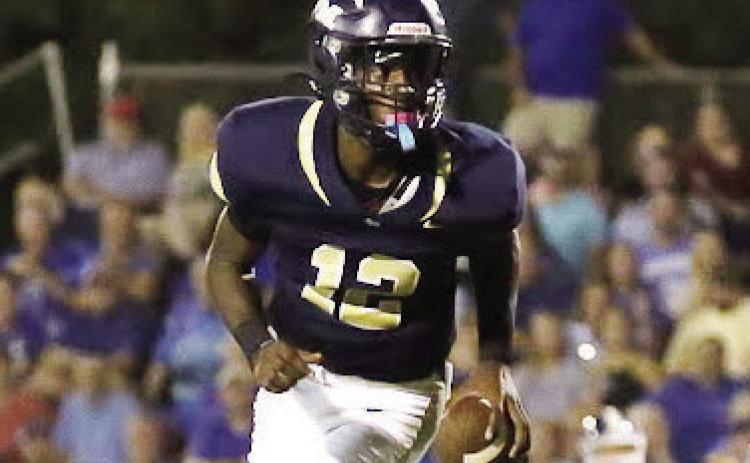 JMA quarterback Lewis Cheney threw for 215 yards and three touchdowns in the Trojans win. TREY NORRIS/ FILE PHOTO