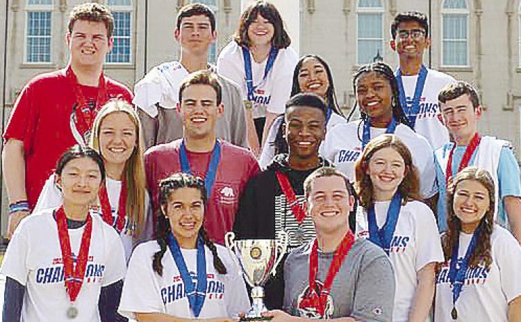GMC Prep students stand on the steps of the GMC Main Campus celebrating another victorious year. CONTRIBUTED