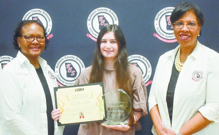 Board of Education chair Dr. Gloria Wicker (left) and Superintendent Dr. Noris Price present a certificate of recognition to The Baldwin Bulletin’s associate editor, Bailey McCully (center). ERIC JONES/Contributed