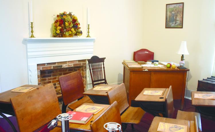 A renovated room in the Sallie Ellis Davis House that mimics a classroom from the historic Eddy High School. BAILEY BALLARD/Staff