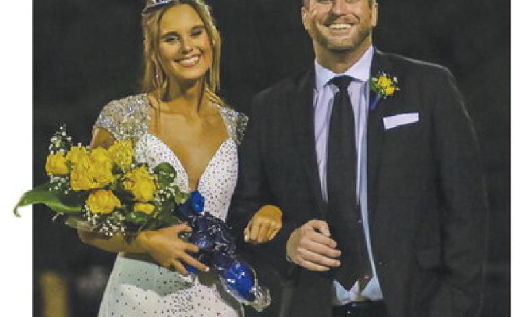 Senior Payton Faulkner (escorted by her father Dustin Faulkner) was named JMAs Homecoming Queen at halftime of last Fridays game at Trojan Field in Milledgeville. TREY NORRIS/Staff