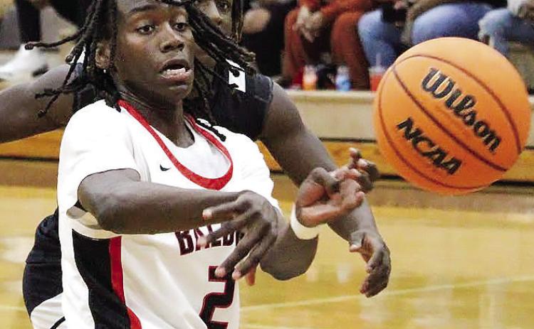 Sophomore guard Karez Demory passes the ball to a teammate last Friday night in a 77-53 win over Howard. TREY NORRIS/Staff 