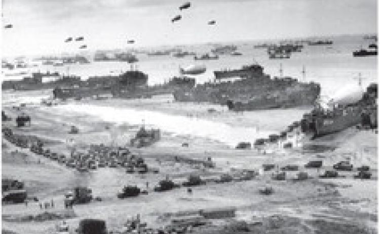 Landing craft and ships unload troops and supplies at Omaha Beach a few days after D-Day. Conseil Régional de Basse-Normandie / US National Archives