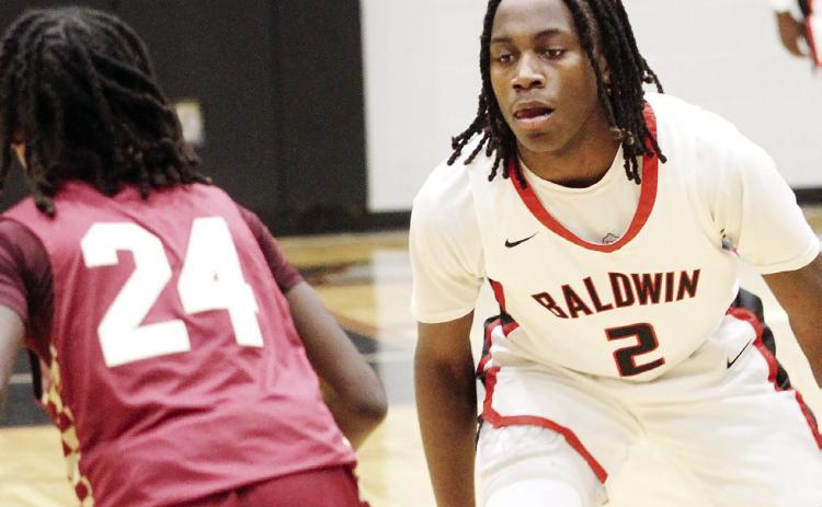 Karez Demory (2) guards a Westside-Macon guard in a win last week. BRAD HARRISON/Staff