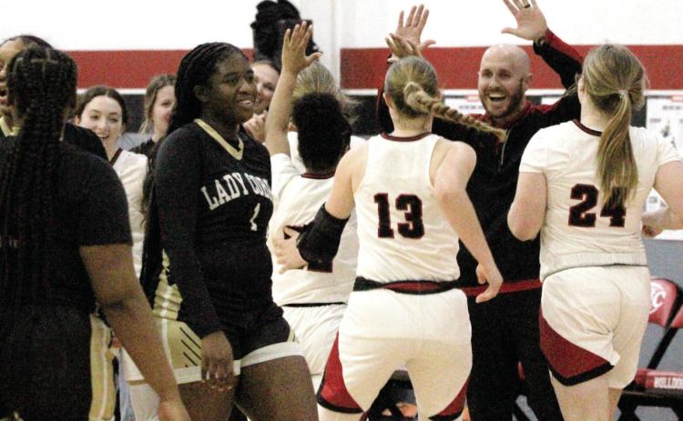 Assistant women’s varsity basketball coach Nolan Baugh cheered on his players immediately following their late comeback.