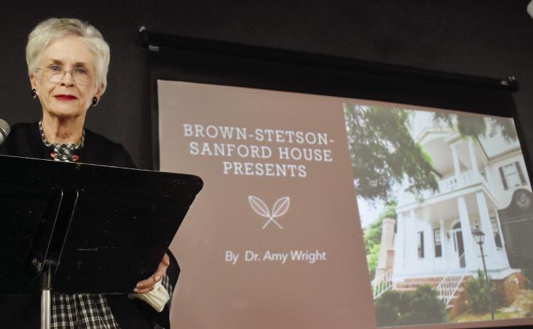 Georgia’s Old Capital Heritage Center at the Depot Executive Director Dr. Amy Wright, dressed in historic attire, presented a 200-year history on the Brown-Stetson-Sanford House. BAILEY BALLARD/Staff