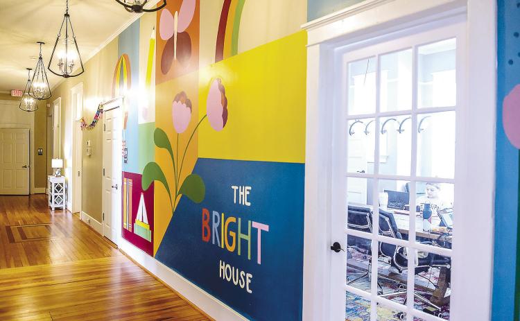Maggie Morgan’s mural at The Bright House in Baldwin County. The mural features a colorful backdrop for a variety of simple designs hand-selected to represent hope, restoration, transformation, and growth. COURTESY OF GCSU