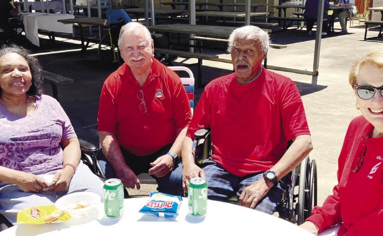 Elks volunteers Bill Lewis and Mary Zachary chat with the residents. CONTRIBUTED