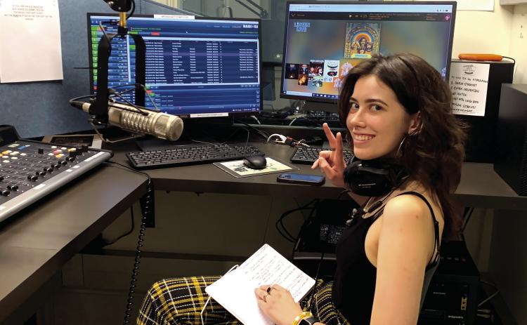 WGUR General Manager Kellen O’Neil in the studio recording her radio show focusing on pop culture and music. COURTESY OF GCSU
