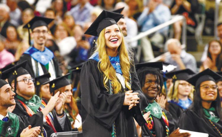 A student from the College of Arts &amp; Sciences stands as she is honored for her achievements. Courtesy of GCSU