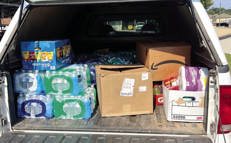 Georgia College &amp; State University loads supplies to deliver to Augusta University. Two deliveries of non-perishable foods, water, electrolyte drinks, hand sanitizers and other critical items were delivered. COURTESY OF GCSU