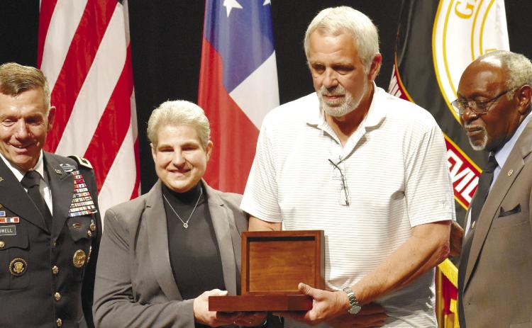 Board of Trustees Member George Hogan, Sr, and President of Georgia Military College Milledgeville Campus Lt. Gen (Ret.) William B. Caldwell IV presented the Hall of Heroes induction award to the children of the Honorable Powell Moore. NICHOLAS RYAN/Staff