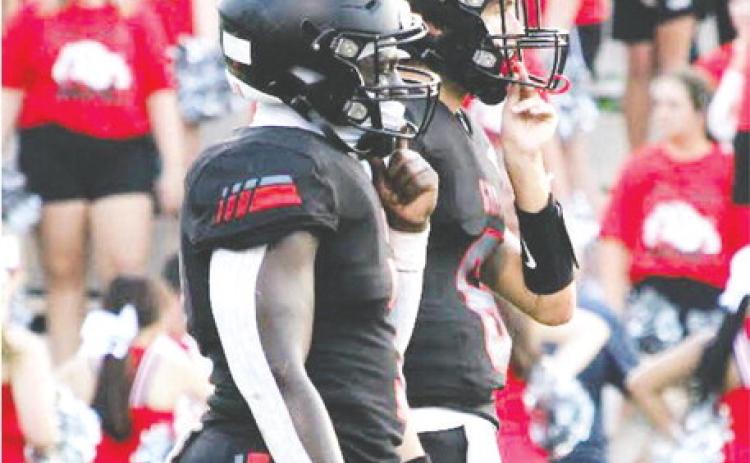 GMC quarterback Nate McMillan and running back Jesse Washington III line up in the shotgun formation.  TREY NORRIS/Staff