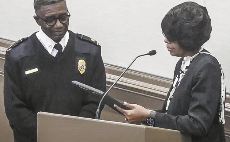 Mayor Mary Parham-Copelan (right) reads the proclamation deeming Jan. 14 Fire Chief Victor Young Day to Young as thanks for his 35 years of service. COURTESY OF MBCTV4