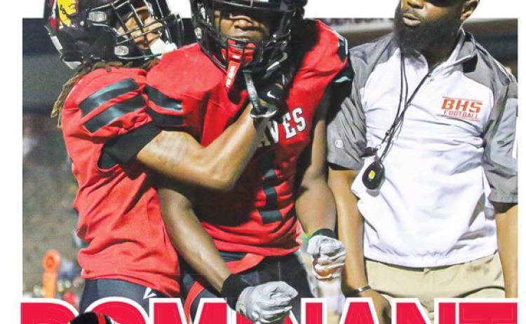 Above, Baldwin’s BJ Armstrong Jr. celebrates with head coach Kevin Patterson and teammates after forcing a fumble vs Washington County.