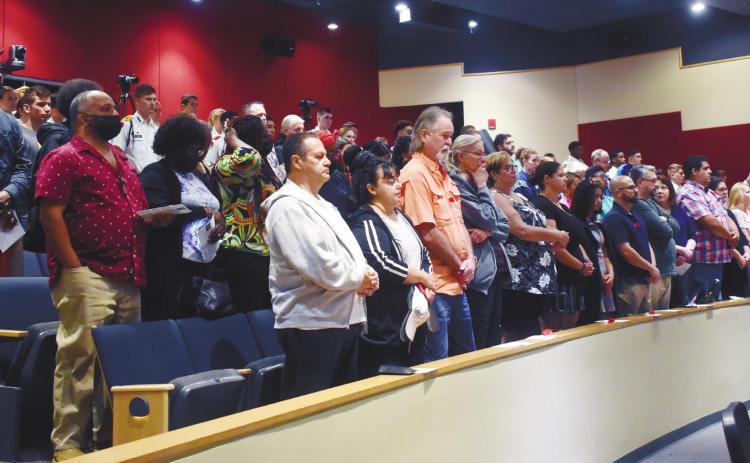 The community and cadets stand for a moment of silence for the fallen. BAILEY BALLARD/Staff