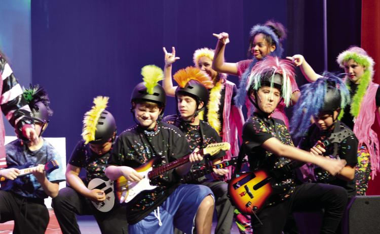 A part of the Spongebob the Musical ensemble rocks out on stage during a musical number. MANDY ELDER/Contributed
