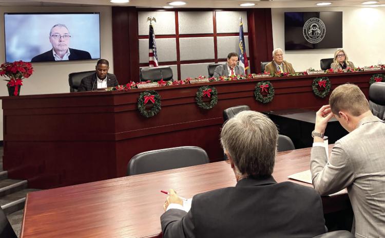 The Georgia Public Service Commission, with member Tim Echols attending remotely, voted Friday, Dec. 19, 2025 to let Georgia Power add nearly 10 gigawatts of capacity, a massive expansion that will cost billions of dollars. TY TAGAMI/Capitol Beat