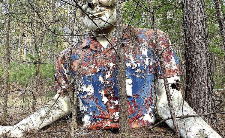 A shot of the 20-foot former Phillips 66 cowboy giant where he sat for 26 years in the woods of Jones County with his legs a short distance away. COURTESY OF JOEL BAKER