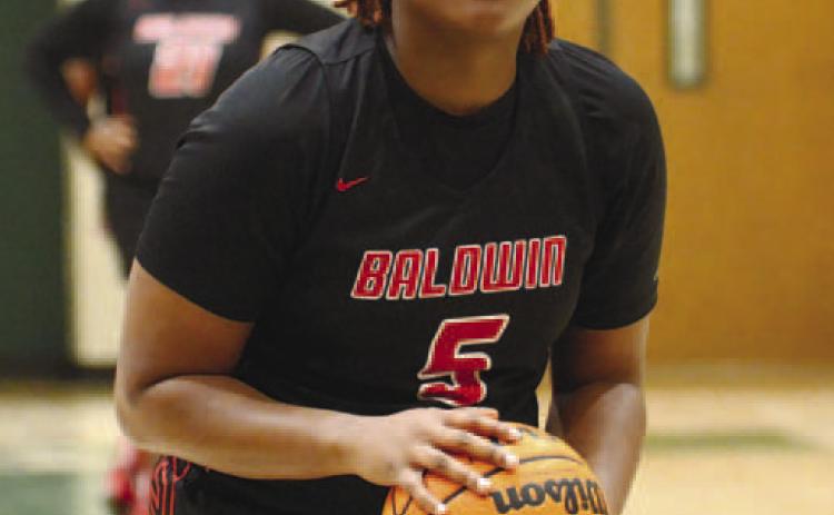 Sophomore Janaye Walker (5) is at the line to shoot a free throw during a game earlier this season. BRENDAN KOERNER/Staff