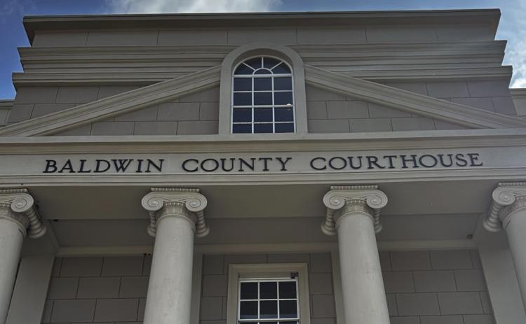Commissioners approve millage rate, among jeers