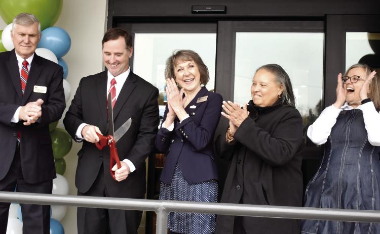 Commissioner Sammy Hall, Chair of the Twin Lakes Library Board Cameron Williams, Georgia Public Library Service State Librarian Julie Walker, Commissioner Emily Davis, and Middle Georgia Regional Library Director Jennifer Lautzenheiser officially reopen the newly renovated Mary Vinson Memorial Library. BAILEY BALLARD/Staff
