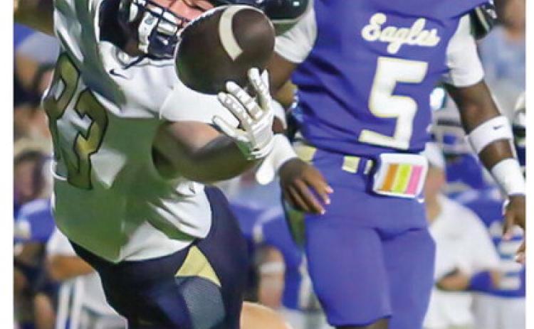 Parker Soltay makes a diving attempt for John Milledge.